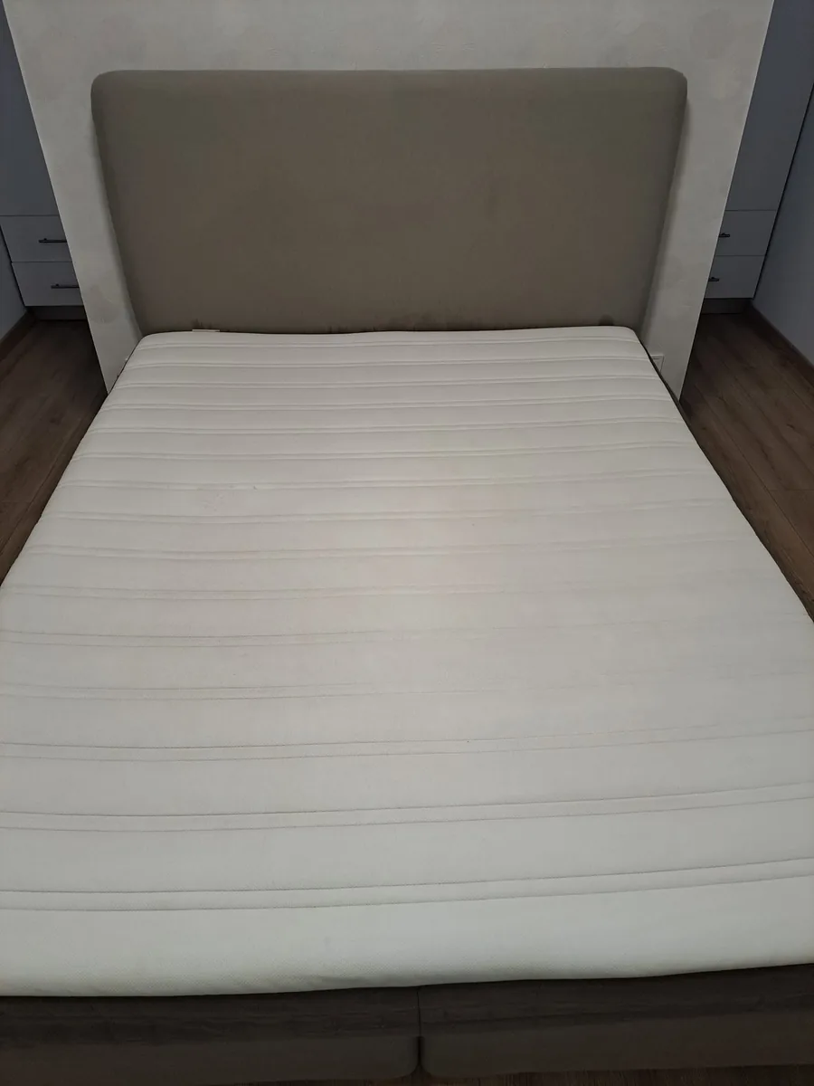 The ribbed white mattress after cleaning, with visibly reduced staining
