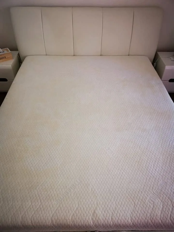 The textured mattress cover after cleaning, with a more even appearance